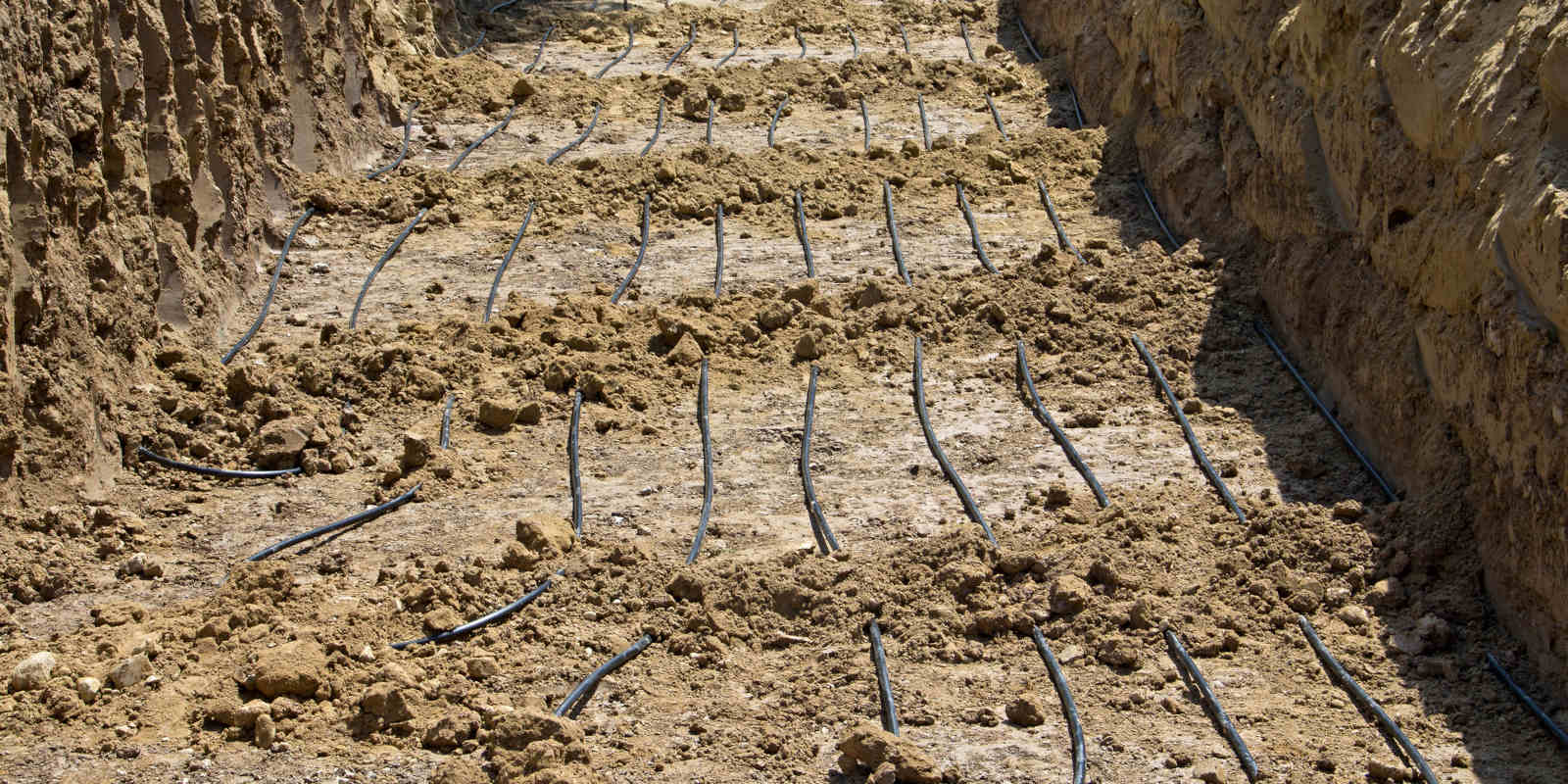 Geothermal loop installation trench